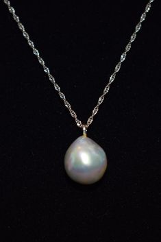 "Here is gorgeous light gray/ blue natural baroque pearl pendant necklace. The 14k white gold diamond cut chain measures 18\" and the baroque pearl is nearly 4 carats! The camera just cannot translate the absolutely beautiful iridescence of this pearl. It is full of pastel gray, blue and pink and measures 12 x 10 mm The pearl was purchased in Hawaii and has never been worn. The white gold chain has been added to allow for immediate wear." Formal Pearl Charm Necklace, Classic Tahitian Pearl Drop Jewelry, White Gold Briolette Pearl Pendant Necklace, Classic White Gold Briolette Pearl Necklace, High Luster Baroque Pearl Necklace For Formal Occasions, Formal High Luster Baroque Pearl Necklace, White Gold Drop Jewelry With High Luster, White Gold Drop Earrings With High Luster, Formal Drop Pearl Necklace In White Gold