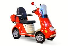 a small red scooter is parked on a white surface with the seat up