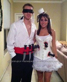 a man and woman dressed up in costumes