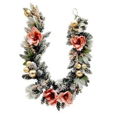 a christmas wreath with flowers and ornaments hanging from it's sides on a white background