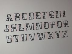 the upper and lower letters are black on white paper