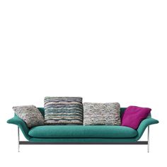 a green couch with colorful pillows on it