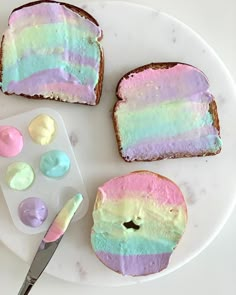 there is a piece of cake with paste on it next to some paint chips and a knife