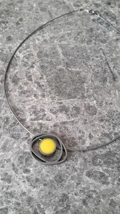 This geometric sterling silver yellow necklace is handmade and unique. Because of this tere may be a small difference in each piece. I used sterling silver (925k)with lost wax technique and and yellow enamel. This pendant was made sandblasting and than oxidized. This contemporary choker necklace are suitable for colored designs and geometric jewelry lovers.Other alternative colors please contact me.Dimensions of round shaped enameled piece are 1*1 cmOutside dimensions of the pendant 2.5*2 cmLeng Yellow Metal Necklace As Gift, Yellow Metal Necklace For Gift, Handmade Minimalist Yellow Necklace, Modern Yellow Jewelry For Gifts, Modern Yellow Jewelry For Gift, Unique Yellow Necklaces For Gifts, Yellow Enamel Pendant Jewelry, Yellow Enamel Round Jewelry, Yellow Sterling Silver Round Pendant Necklace