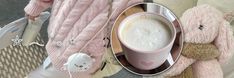 a pink teddy bear sitting on top of a bed next to a cup of coffee