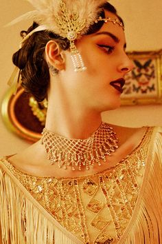 This sumptuous piece of jewelry features a retro-elegant yet slightly modern style that complements the lavish garments, reminiscent of the roaring 1920s. Features: High quality rhinestones Multi layer sparkling rhinestone tassels Height: 2.36 inch / 6 cm Length: 20 inch / 50.8 cm (extension chain included) Gold Gatsby Style Party Jewelry, Glamorous Diamond Necklaces For Parties, Glamorous Diamond Necklaces For Evening, Glamorous Crystal Necklace For Formal Occasions, Glamorous Crystal Necklace For Formal Events, Elegant Beaded Necklace For Party, Glamorous Sparkling Crystal Bridal Necklace, Sparkling Diamond Bridal Necklace For Evening, Elegant Sparkling Bridal Necklace For Party