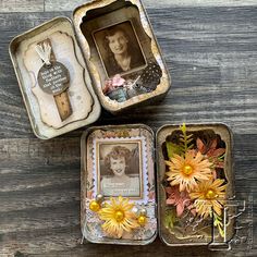 three tins with pictures and flowers in them