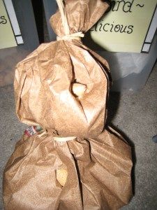 a brown paper bag sitting on the ground