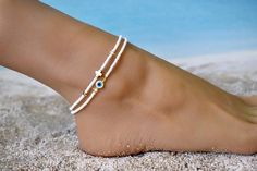 Cross Anklet, White Beaded Anklet, White and Gold Anklet, Ankle Bracelet, Foot Bracelet, Beach Anklet, Beach Jewelry, Anklets for Women This beautiful anklet is made to order using genuine hematite and Czech seed beads. Hematite has a high protective energy and is excellent for grounding and White Round Beads Anklets For Vacation, White Beaded Strand Anklet, White Anklets For Beach Season Gift, Handmade White Beachy Anklets, Cross Anklet, Jewelry Anklets, Protective Energy, Anklets For Women, Beautiful Anklet