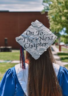 a girl in her graduation cap that says on to the next charter, she is looking back