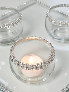 a candle is sitting in a glass bowl