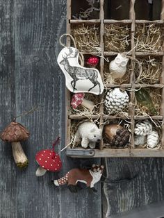 an old wooden box filled with christmas ornaments