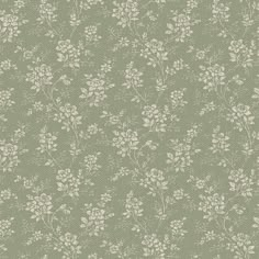 a green wallpaper with white flowers on it