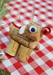 a wine cork reindeer ornament sitting on top of a red and white checkered tablecloth