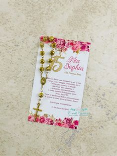 a rosary with flowers on it and a card attached to the cross that says, st julia sophia