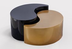 two black and gold tables sitting next to each other