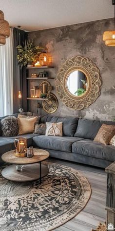 a living room filled with lots of furniture next to a wall mounted mirror and window