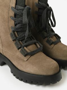 DESCRIPTION:Combat-style boot made from water-resistant suede with a lofty lugged sole.FEATURES:Lace-Up VampRound ToeInner Ankle ZipUpper: Water-Resistant SuedeRemovable Cushioned InsoleSole: RubberHeel Height: 1.75 in. Combat Style, Water Resistant, Lace Up, Boots, Lace, Water