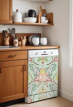 a dishwasher sitting on top of a wooden counter