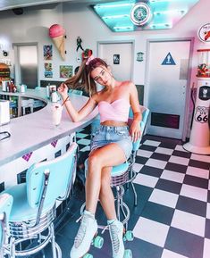 a woman sitting at a bar with roller skates on her feet