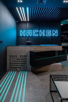 the interior of a modern restaurant with neon lights