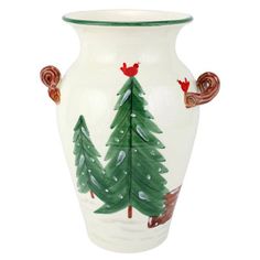 a white vase with green trees painted on the side and red birds perched on top