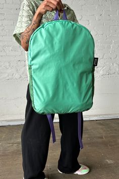 Experience the ultimate in convenience and sustainability with our Upcycled Packable Backpack in Teal, perfect for your everyday transit needs. Made from high-quality sustainable materials, this backpack is not only functional but also environmentally friendly. Details: Sustainable Packable Backpack Padded Straps Fold into pocket Fabric Content: Upcycled Nylon, 3-D Knit, Upcycled Chaco® Straps Waste Diversion: 0.6 lbs. Dimensions: 19"L X 4"W X 12" H Note: Each colorway is extremely limited in av Functional Recycled Polyester Backpack For Daily Use, Functional Daily Backpack In Recycled Polyester, Functional Daily Use Backpack In Recycled Polyester, Functional Recycled Polyester Backpack For Outdoor Activities, Functional Backpack For Outdoor Activities In Recycled Polyester, Functional Backpack For Outdoor Activities Made Of Recycled Polyester, Functional Nylon Backpack With Recyclable Material, Functional Recyclable Nylon Backpack, Green Backpack With Water Bottle Pocket For Everyday Use