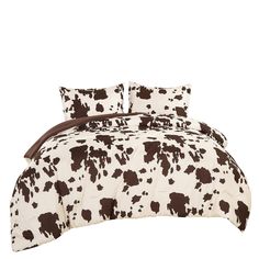 a brown and white cow print comforter set