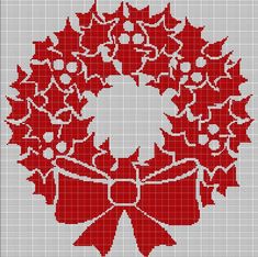 a cross stitch christmas wreath with red bows