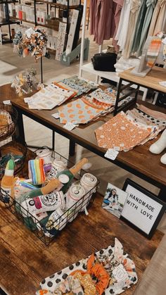 the table is full of different items for sale at the store, including cloths and paper towels