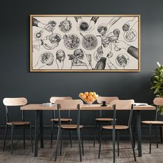 a black and white drawing hangs above a dining room table