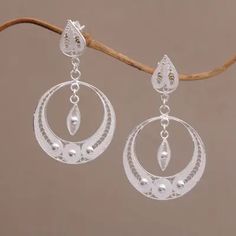 Filigree Sterling Silver Dangle Earrings Handmade in Java - Ethereal Moon | NOVICA Silver Dangle Chandelier Earrings With Intricate Design, Crescent Jewelry With Intricate Design, Traditional Hypoallergenic Drop Earrings, Crescent Shaped Jewelry With Intricate Design For Gift, Artisan Silver Filigree Earrings, Sterling Silver Filigree Dangle Chandelier Earrings, Bohemian Sterling Silver Chandelier Earrings With Intricate Design, Traditional Silver Hypoallergenic Earrings, Traditional Hypoallergenic Sterling Silver Earrings