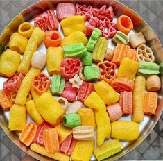 a plate full of cut up fruits and vegetables