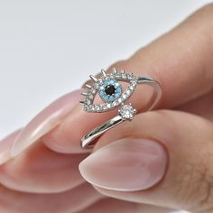 "Diamond eye ring, evil eye ring, lucky ring, adjustable ring, stackable ring,crystal gems, silver, gold 14K, zircon inlaid,gift for her. Free international shipping blue eye ring studded with gemstone in silver and gold plating. The ring is made of silver plated with 14 carat gold, and is designed in the shape of delicate drop. The pendant is in the shape of a blue eye and is set with blue gemstone. blue eye ring is symbol of protection against the evil eye. The blue stone in the ring is symbol of protection, good luck and spirituality. This ring is perfect gift for anyone you want to protect. Add these simple yet stylish rings to your collections, bold and confident. They really go with everything!! ∙ Metal type: 14K gold plating/ silver ∙ Stain resistance. ∙ Safe for sensitive skin. ∙ N Blue Eye Ring, Lucky Ring, Ring Crystal, Diamond Eyes, Evil Eye Ring, Stylish Rings, Minimalist Gifts, Blue Eye, Eye Ring