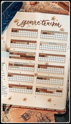 an open planner sitting on top of a table next to some papers and pens with the words gone tracker