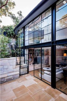 the outside of a house with glass walls