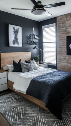 a bed room with a neatly made bed next to a window and a ceiling fan