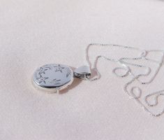 Delicate Silver Locket Necklace This super cute Sterling Silver Necklace features one delicate locket pendant along a dainty silver chain. The locket has a perfectly working clasp with space inside for two tiny photos or pictures. A beautifully understated miniature piece of jewelry that is ideal for layering with other necklaces, or worn by itself. Features: - Sterling silver box chain, length 18 inch - Material: 925 sterling silver - Sterling Silver Locket Pendant Locket Options: - oval locket Black Pencil Case, Silver Heart Locket, Silver Locket Necklace, Silver Pen, Pendant Locket, Wedding Day Gifts, Sterling Silver Locket, Oval Locket, Heart Keyring