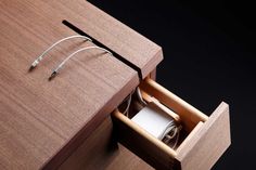 an open drawer with some wires in it