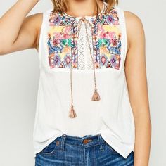 Nwt Hayden White Multi-Color Embroidered Sleeveless Top M A Solid Hued Sleeveless Top Featuring Front Multi-Color Embroidered Details, A Multi-Color Tassel, A Crochet Cutout Detail, And A Rounded Neckline. 100% Cotton New. With. Tag. Spring Embroidered Sleeveless Vest, Sleeveless Embroidered Spring Vest, Spring Sleeveless Embroidered Vest, Embroidered Sleeveless Vest For Spring, Sleeveless Embroidered Vest For Spring, Summer Sleeveless Embroidered Vest, Sleeveless Embroidered Vest For Summer, Cotton Vest With Multicolor Embroidery, Embroidered Beach Tank Top For Spring