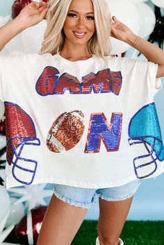 100% COTTON Model Wearing Size Small Color: White, Red, Blue Round Neckline Short, Dolman Sleeves Sequin "Game On" Text With Football & Helmet Graphics Boxy & Oversized Fit 15" Armpit To Hemline For Model Size Specs Please Check Size Charts + Live Feed Notes Below Launched: 8/18/23 Game Day Attire For Women, Game Day Fits, Diy Shirt Printing, Helmet Graphics, Football Casual Clothing, Cricut Shirts, Graphic Dress, Flying Monkey Jeans, Football Helmet