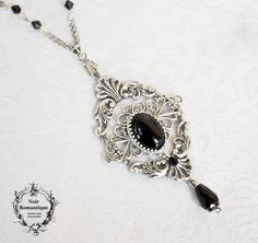 "♥♥Noir Romantique♥♥ Welcome to my store! \"The Duchess Necklace\" This amazing victorian inspired necklace is made of silver plated ornament decorated with silver N925 setting and black onyx gemstone 13x18mm.Two silver rococo connectors are set below and over the centerpiece and finally a black amethyst teardop is hanging.It is also decorated with black beads. ♥♥ The metal parts are of high quality brass ♥♥ Nickel and lead free ♥♥All metal components are silver plated brass of high quality, pro Classic Silver Baroque Necklace, Black Engraved Necklace For Wedding, Black Pendant Necklace With Intricate Design, Antique Black Sterling Silver Necklace, Silver Onyx Gothic Necklace, Gothic Silver Onyx Necklace, Victorian Black Necklace For Formal Occasions, Black Victorian Necklace For Formal Occasions, Ornate Black Necklace For Formal Occasions