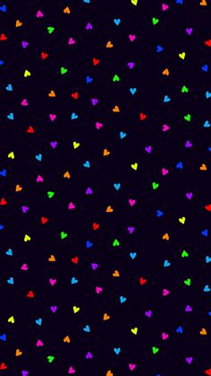 multicolored hearts on black background