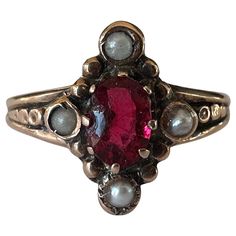 Crafted in the late nineteenth century, this antique navette shaped dinner ring is designed around an oval red garnet and accented by four seed pearls. Set in 10K rose gold. Dark Red Jewelry, Vintage Ruby Rings, Indian Engagement Ring, Antique Rings Victorian, Dinner Ring, Seed Pearl Ring, Victorian Engagement Rings, Cute Engagement Rings, Antique Wedding Rings