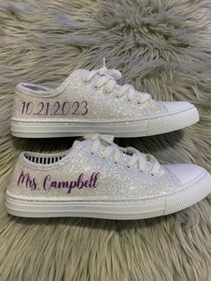 Hand Glittered unbranded canvas sneakers glittered in a gorgeous chunky white mix called *bungalow* with purple glitter personalization of your choice. Shown with white glitter trim, optional. Made to order. Glitter is high quality and heat set for minimal glitter loss and lasting quality, though, you may see glitter shedding the first time you wear/try on your shoes. Although we aim to remove every loose piece of glitter prior to shipment, the shipping process s well as putting them on and adju Low-top Glitter Sneakers For Wedding, Purple Glitter Low-top Sneakers, Xhosa Traditional Wedding Dresses, Wedding Tennis Shoes, Bling Stuff, Bride Sneakers, Sparkle Sneakers, Wedding Shoes Sneakers, Purple Reception