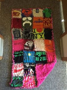 a blanket made out of t - shirts on the floor