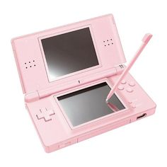 a pink nintendo wii game system with a pen in it's lap and screen