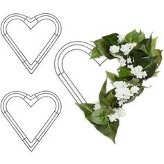 two heart shaped paper clips with flowers on them and one in the shape of a wreath