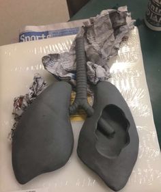 a pair of gray shoes sitting on top of a table