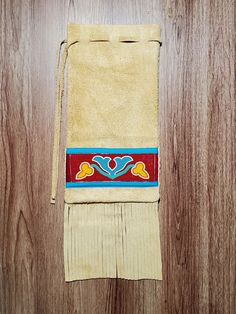 a brown towel sitting on top of a wooden floor